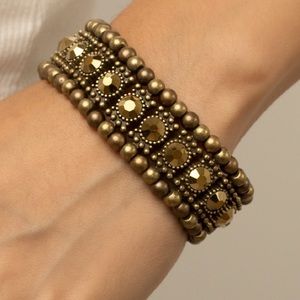 5 for 25 Brass tone stretch bracelet with brass colored stones.